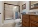 A bathroom features a shower-tub combination and a vanity with a granite countertop at 250 Brigham Nw Rd, Winter Haven, FL 33881
