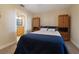 A bedroom features matching built-in wardrobes and an ensuite bath with a vanity at 250 Brigham Nw Rd, Winter Haven, FL 33881