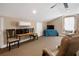 Bonus room offers a table, chairs, TV, window seat and ceiling fan at 250 Brigham Nw Rd, Winter Haven, FL 33881