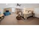 Large bonus room featuring a queen bed, seating, TV, window seat and ceiling fan at 250 Brigham Nw Rd, Winter Haven, FL 33881