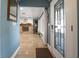Foyer view into the living room featuring tile flooring, fireplace, and ample natural light at 250 Brigham Nw Rd, Winter Haven, FL 33881