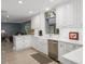 Bright, open kitchen with white cabinetry, stainless steel appliances, and ample counter space at 250 Brigham Nw Rd, Winter Haven, FL 33881