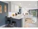 Beautiful kitchen featuring white cabinets, tile backsplash, stainless appliances, and breakfast bar at 250 Brigham Nw Rd, Winter Haven, FL 33881