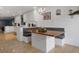 Eat-in kitchen with custom banquet and breakfast bar provides ample seating and natural light at 250 Brigham Nw Rd, Winter Haven, FL 33881
