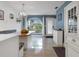 Bright kitchen offers a custom breakfast nook, pendant lighting, and white shaker cabinetry at 250 Brigham Nw Rd, Winter Haven, FL 33881