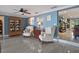 Living room with comfortable seating, tile floors, and views into other living spaces at 250 Brigham Nw Rd, Winter Haven, FL 33881