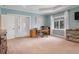 A large main bedroom has outdoor access to the lanai and a work space, with large windows for abundant natural light at 250 Brigham Nw Rd, Winter Haven, FL 33881