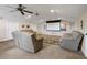Spacious carpeted home theater featuring comfortable leather seating and a projector screen for the ultimate viewing experience at 250 Brigham Nw Rd, Winter Haven, FL 33881
