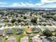 Birds-eye view of this home surrounded by single Gathering homes with lush greenery and a location pin at 251 Kings Pond Ave, Winter Haven, FL 33880