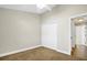 Bedroom with a carpeted floor, ceiling fan, neutral paint, and double door closet at 251 Kings Pond Ave, Winter Haven, FL 33880