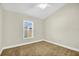 Bedroom featuring a carpeted floor, neutral paint, ceiling fan, and a window with blinds at 251 Kings Pond Ave, Winter Haven, FL 33880