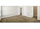 Spacious main bedroom with soft carpet, neutral walls, and access to an ensuite bathroom at 251 Kings Pond Ave, Winter Haven, FL 33880