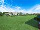Large, well-maintained backyard featuring lush green grass, perfect for outdoor activities at 2824 Attwater Loop, Winter Haven, FL 33884