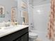 Clean, tiled bathroom with sink and shower at 2824 Attwater Loop, Winter Haven, FL 33884