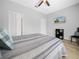 Cozy bedroom with ceiling fan and adjacent storage at 2824 Attwater Loop, Winter Haven, FL 33884