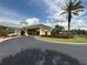 Beautiful clubhouse with an American flag and lush landscaping at 2824 Attwater Loop, Winter Haven, FL 33884