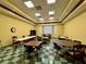 Multi-purpose clubhouse area featuring tables, chairs, and tile flooring for community gatherings at 2824 Attwater Loop, Winter Haven, FL 33884