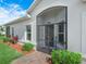 Screened front entry way with brick pavers and lovely landscaping at 2824 Attwater Loop, Winter Haven, FL 33884