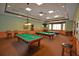Spacious game room featuring three billiard tables and comfortable seating at 2824 Attwater Loop, Winter Haven, FL 33884