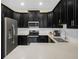 Modern kitchen with stainless steel appliances and white subway tile backsplash at 2824 Attwater Loop, Winter Haven, FL 33884