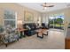 Comfortable living room with tile flooring and sliding glass doors to a lanai at 2824 Attwater Loop, Winter Haven, FL 33884