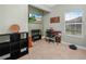 Cozy office with work desk, large window, and decor at 2824 Attwater Loop, Winter Haven, FL 33884