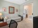 Bright room with sofa and view of the adjacent bathroom at 2824 Attwater Loop, Winter Haven, FL 33884