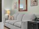 Comfortable sofa with side table and decorative pillows at 2824 Attwater Loop, Winter Haven, FL 33884