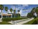 Shuffleboard court surrounded by lush landscaping and seating areas at 2824 Attwater Loop, Winter Haven, FL 33884