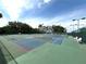 Enjoy the sunny weather on the community tennis courts with pristine surfacing and clear blue skies at 2824 Attwater Loop, Winter Haven, FL 33884