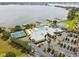 Aerial view of a lakefront community center featuring pool, tennis courts, parking and other amenities at 2980 Dayton Dr, Winter Haven, FL 33884