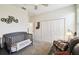 Cozy bedroom with a crib, sofa, and ample closet space, perfect for a Bedroom or guest room at 2980 Dayton Dr, Winter Haven, FL 33884