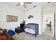 Bright room setup with crib, TV, toys, and easy access to other parts of the home at 2980 Dayton Dr, Winter Haven, FL 33884