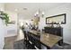 Open-concept dining room with stylish furniture and decor, flowing into the kitchen and living areas at 2980 Dayton Dr, Winter Haven, FL 33884