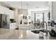 Stylish kitchen featuring a central island with white countertop and stainless steel appliances at 2980 Dayton Dr, Winter Haven, FL 33884