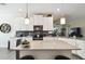 Modern kitchen with a gray backsplash, stainless steel appliances, and gray countertops at 2980 Dayton Dr, Winter Haven, FL 33884