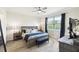 Well-lit main bedroom with large window and comfortable furniture, creating a cozy and inviting space at 2980 Dayton Dr, Winter Haven, FL 33884