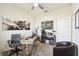 Well-lit office featuring a ceiling fan, wooden desk, comfortable chair and aviation art at 2980 Dayton Dr, Winter Haven, FL 33884