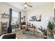 Inviting home office with a ceiling fan, filled with plants, comfortable chair, and aviation art at 2980 Dayton Dr, Winter Haven, FL 33884