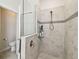 Modern walk-in shower with glass partition, gray tile, and sleek fixtures for a contemporary bathroom at 2980 Dayton Dr, Winter Haven, FL 33884