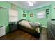 A bedroom featuring a queen bed and dark wood floors at 3022 Hickory Nw St, Winter Haven, FL 33881