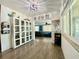 Bright hallway provides natural light and offers a view into the living room at 3022 Hickory Nw St, Winter Haven, FL 33881