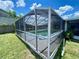 The screened in pool provides relaxing space to enjoy the Florida weather at 3022 Hickory Nw St, Winter Haven, FL 33881
