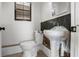 Bathroom with a black tiled accent wall, and toilet and sink ready for installation at 305 Armour Ave, Auburndale, FL 33823