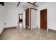 Living room with neutral walls, tile floors, modern architectural details, and multiple entrances at 305 Armour Ave, Auburndale, FL 33823