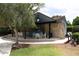 Outdoor barbecue and dining area with stone accents at 333 Lake Howard Nw Dr # 103C, Winter Haven, FL 33880
