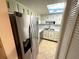 Bright kitchen features stainless steel appliances, tile floors, and skylight at 333 Lake Howard Nw Dr # 103C, Winter Haven, FL 33880