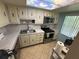 Kitchen featuring stainless steel appliances and neutral countertops at 333 Lake Howard Nw Dr # 103C, Winter Haven, FL 33880