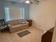 Cozy living room with tile flooring and a comfortable sofa at 333 Lake Howard Nw Dr # 103C, Winter Haven, FL 33880