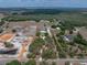 Expansive aerial view of property with serene setting, horse facilities, barns and sheds, and mature trees at 3805 Mammoth Grove Rd, Lake Wales, FL 33898